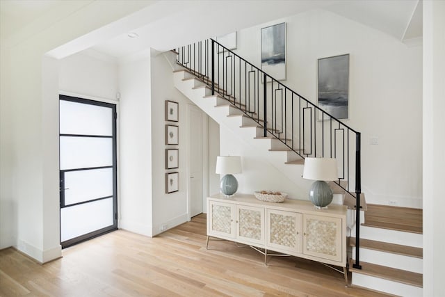 stairs featuring hardwood / wood-style flooring