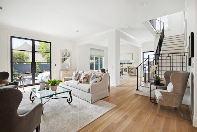 living room with light hardwood / wood-style flooring