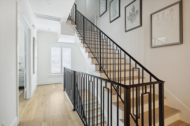 stairway featuring hardwood / wood-style floors