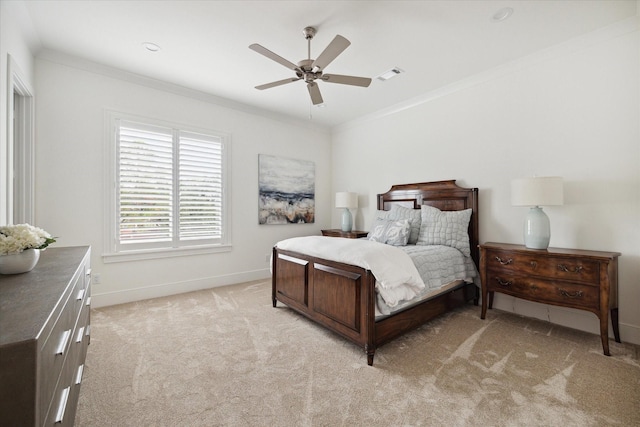 carpeted bedroom with ceiling fan and crown molding