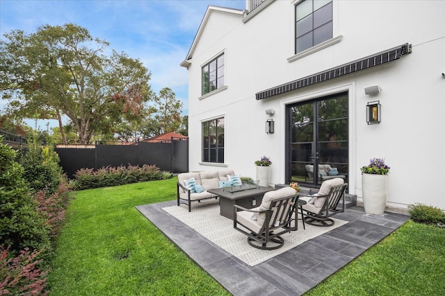 back of house with a lawn, outdoor lounge area, and a patio