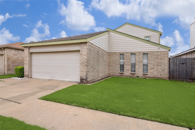 view of front facade featuring a front lawn and a garage