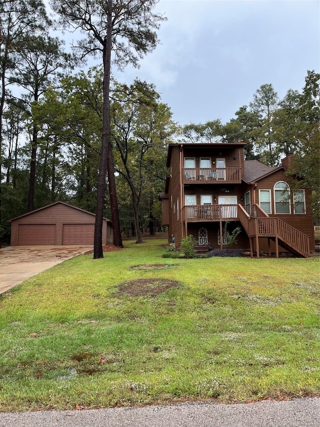 exterior space with an outbuilding, a garage, and a front yard