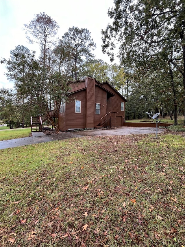 view of side of home featuring a yard