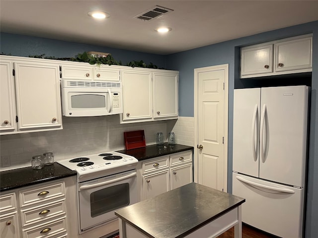 kitchen featuring backsplash, white appliances, dark hardwood / wood-style floors, and white cabinets