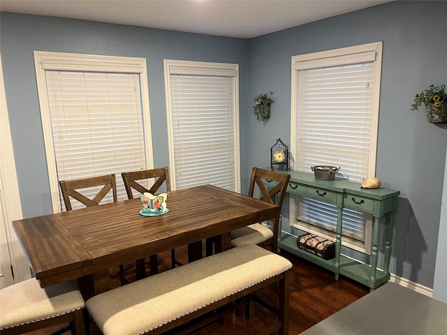 dining area with dark wood-type flooring