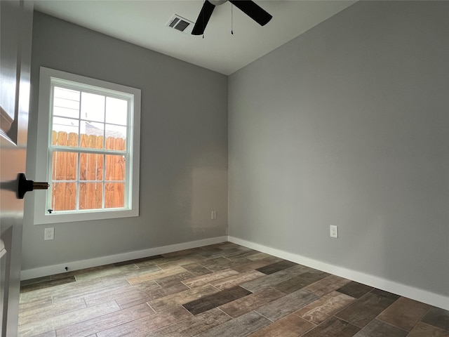 empty room featuring ceiling fan and wood-type flooring