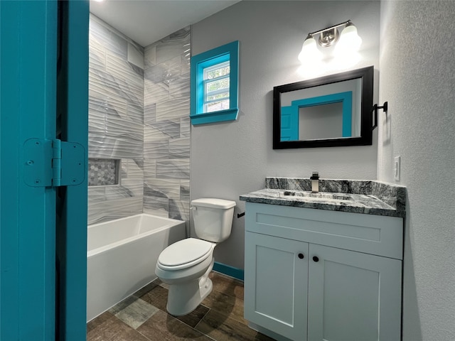 full bathroom with vanity, toilet, and tiled shower / bath combo