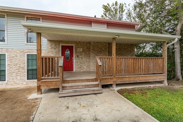 doorway to property with a porch