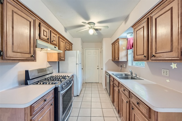 kitchen featuring ceiling fan, light tile patterned flooring, sink, and appliances with stainless steel finishes