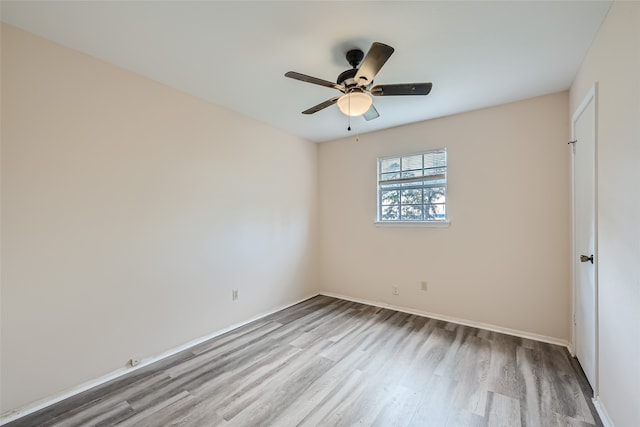 unfurnished room featuring ceiling fan and light hardwood / wood-style floors