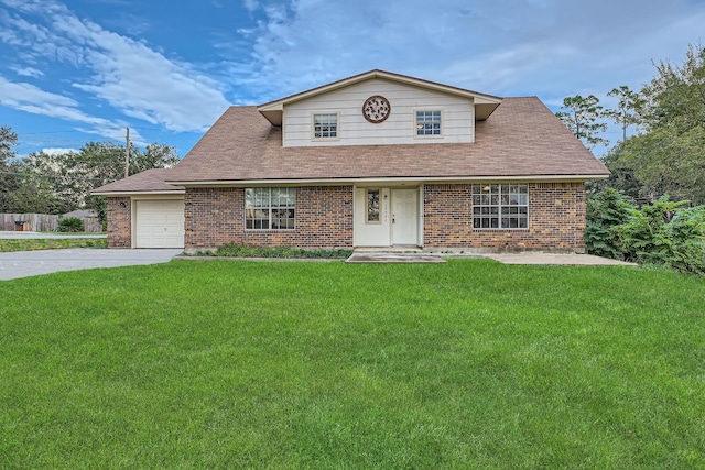 view of front of house featuring a garage and a front lawn