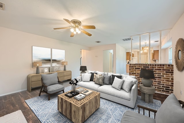 living room with ceiling fan and dark wood-type flooring