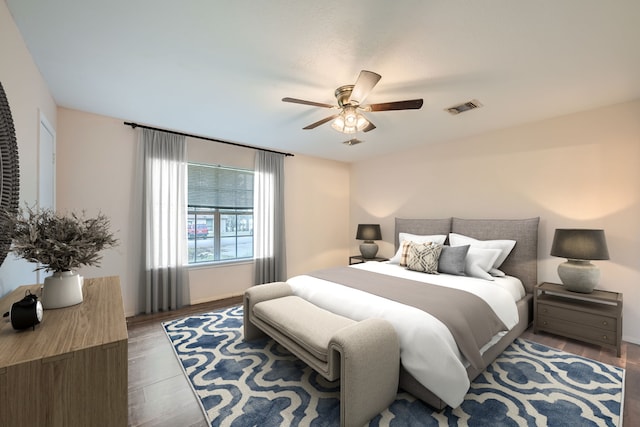 bedroom featuring ceiling fan and dark wood-type flooring