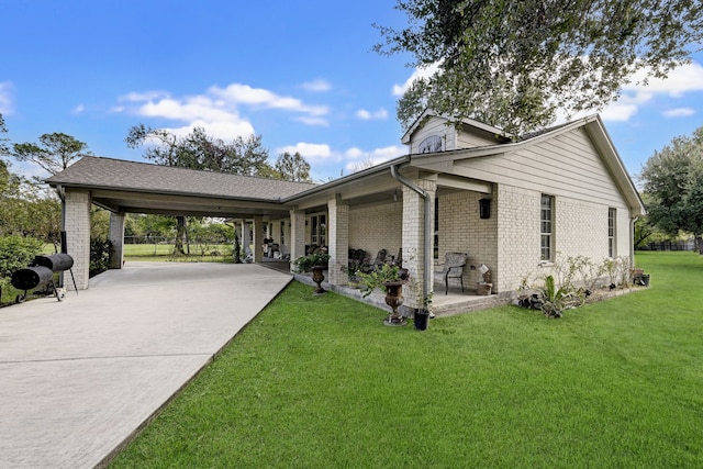 view of property exterior featuring a yard and a carport