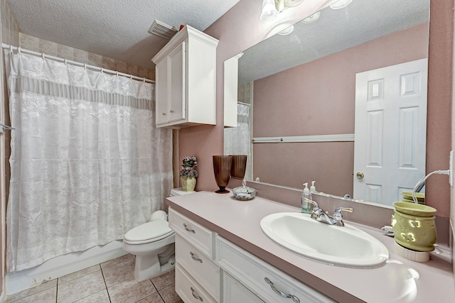 full bathroom with vanity, tile patterned flooring, toilet, a textured ceiling, and shower / tub combo with curtain