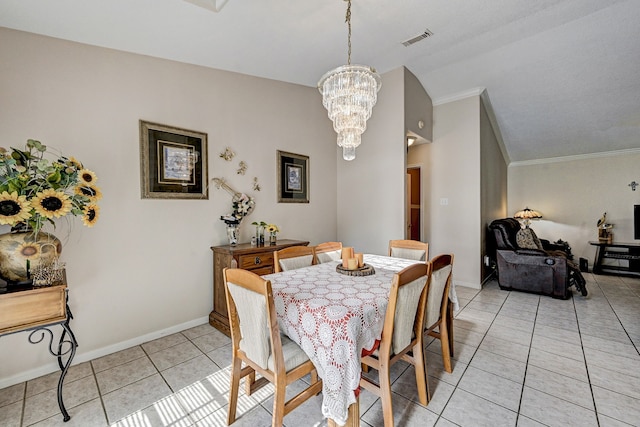 tiled dining space with a chandelier, lofted ceiling, and crown molding