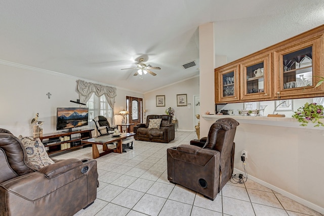 tiled living room with ceiling fan, ornamental molding, and lofted ceiling