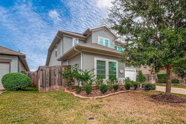 view of property exterior with a garage and a yard