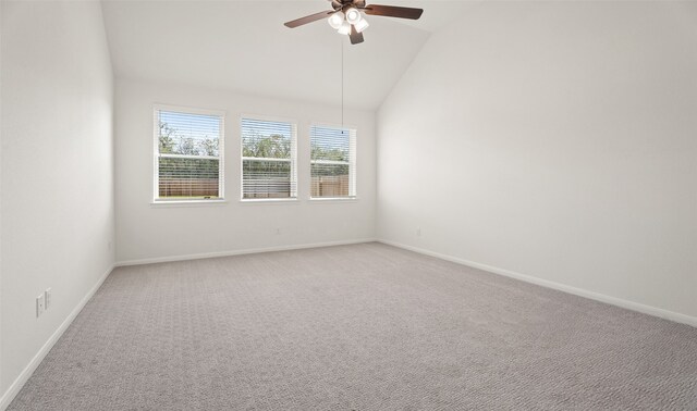 unfurnished room with carpet flooring, lofted ceiling, and ceiling fan