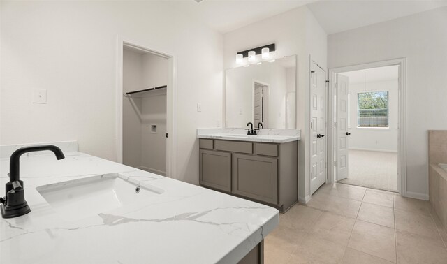 bathroom with tile patterned flooring and vanity