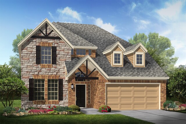 view of front of home with a garage and a front yard