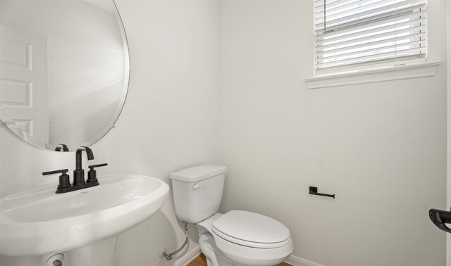 bathroom featuring sink and toilet