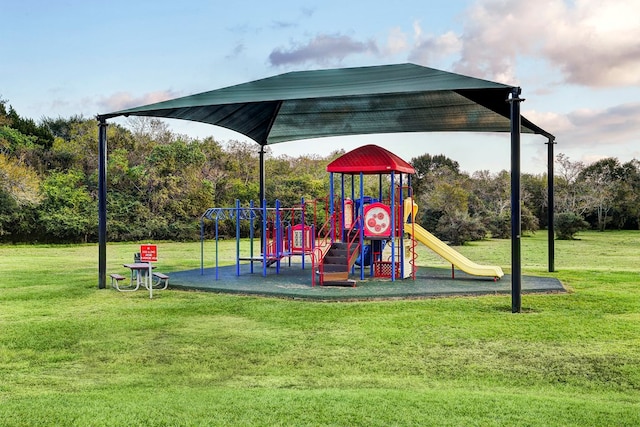 view of playground with a lawn