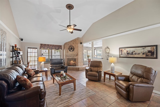 living room with a fireplace, a wealth of natural light, light tile patterned floors, and high vaulted ceiling