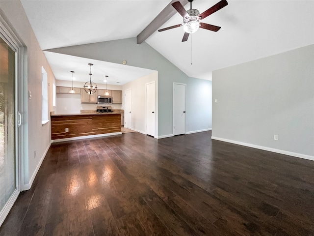 unfurnished living room featuring dark hardwood / wood-style floors, ceiling fan with notable chandelier, and lofted ceiling with beams