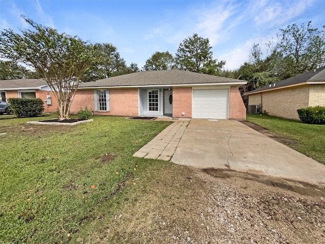 ranch-style house featuring a garage, cooling unit, and a front lawn