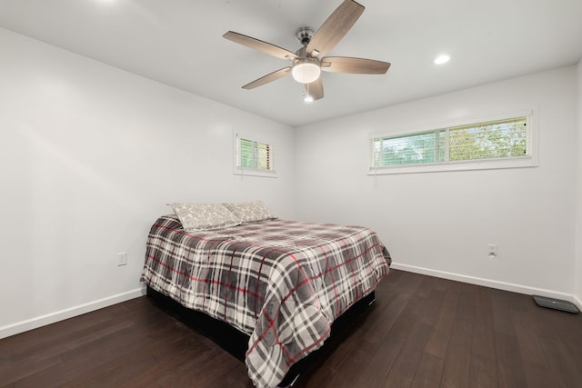 bedroom featuring dark wood-type flooring and ceiling fan