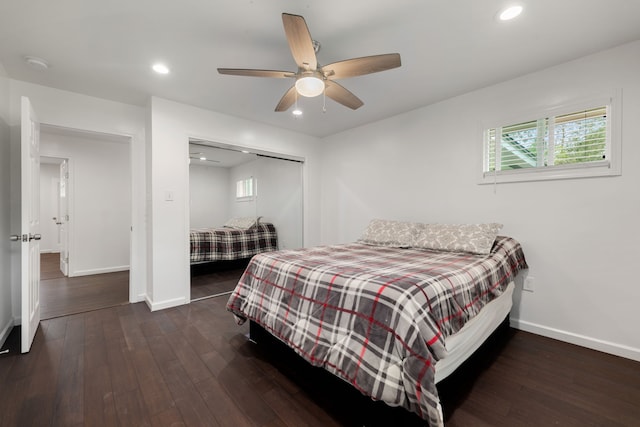 bedroom with dark hardwood / wood-style flooring, a closet, and ceiling fan