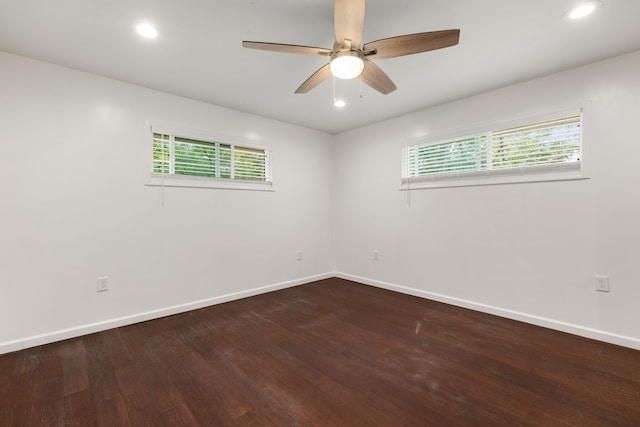 spare room featuring hardwood / wood-style floors and ceiling fan