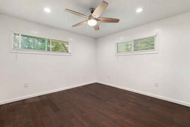 spare room with hardwood / wood-style flooring and ceiling fan