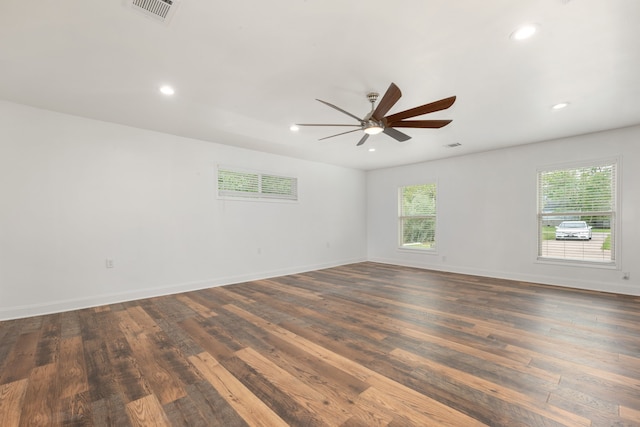 spare room with ceiling fan and dark hardwood / wood-style flooring