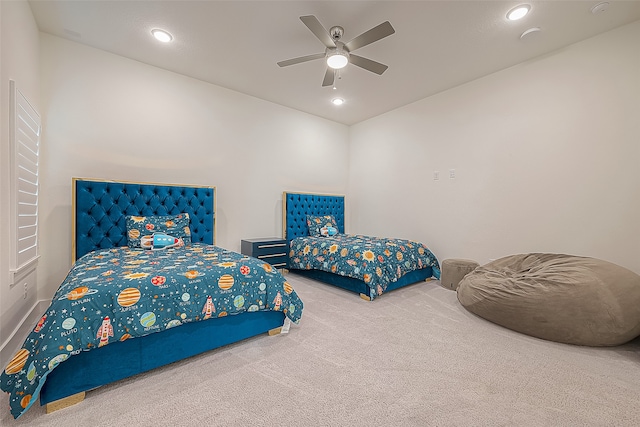 bedroom with ceiling fan and carpet flooring