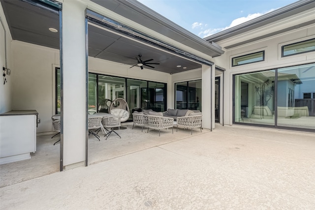 view of patio / terrace with a ceiling fan, outdoor dining space, and an outdoor hangout area