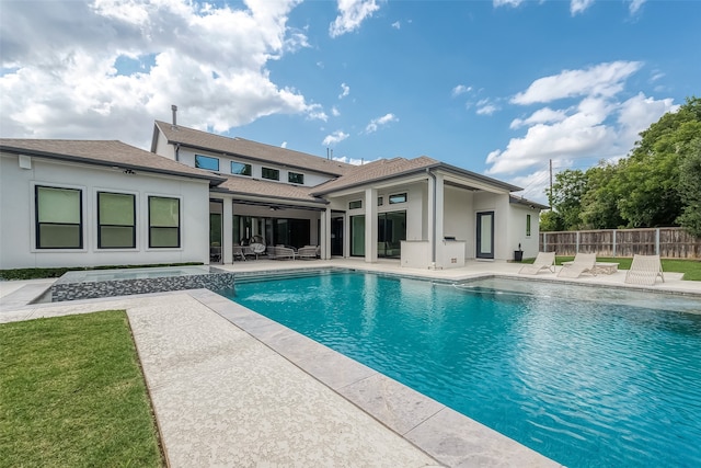 view of swimming pool featuring a fenced in pool, a patio area, and fence