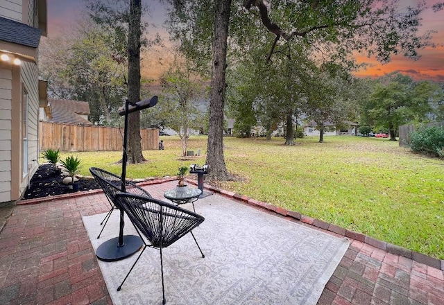 patio terrace at dusk with a yard