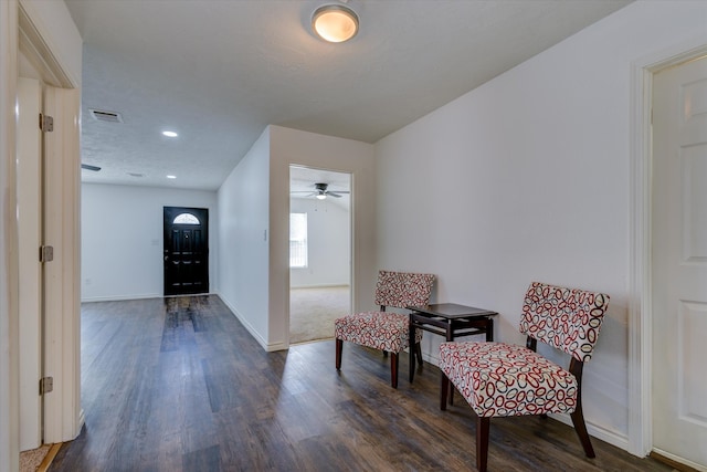 entryway with dark hardwood / wood-style flooring and ceiling fan