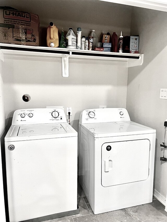 washroom featuring washer and clothes dryer