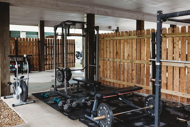 workout area featuring wood walls