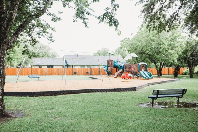 view of playground with a yard