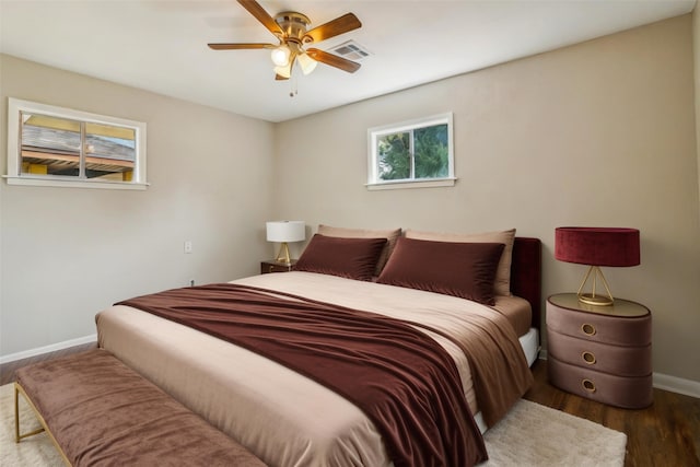 bedroom featuring ceiling fan and dark hardwood / wood-style flooring