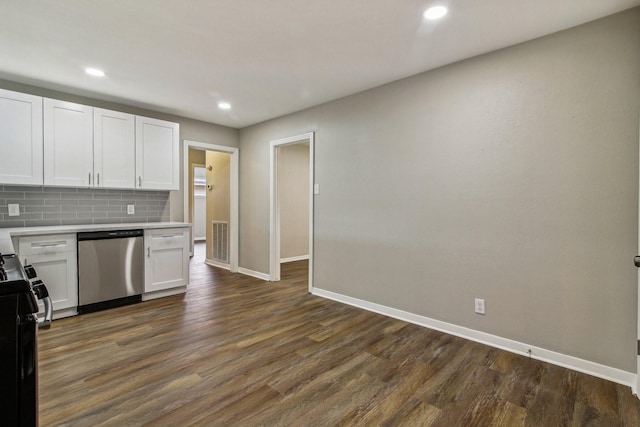 kitchen featuring dishwasher, dark hardwood / wood-style flooring, white cabinetry, and backsplash