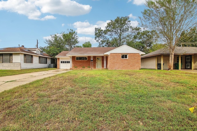 ranch-style home featuring a garage and a front lawn