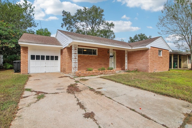 ranch-style house with a garage and a front lawn