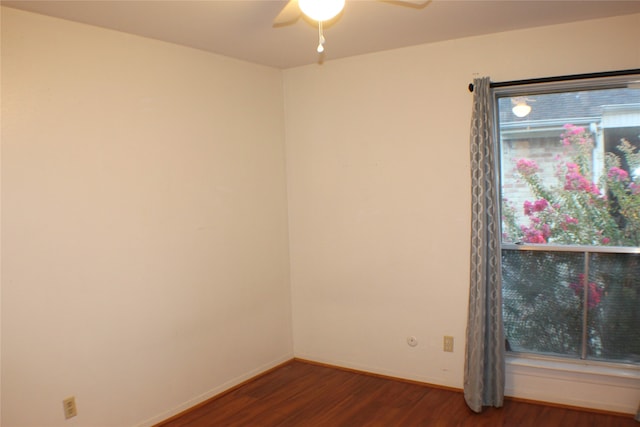 empty room featuring dark hardwood / wood-style floors and ceiling fan