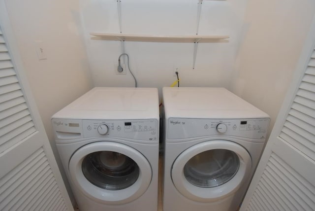 clothes washing area featuring washing machine and clothes dryer